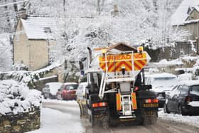 Snow plough and gritter in snowy weather, England, UK. Photo by Adrian Sherratt/Construction Photography/Avalon/Getty Images