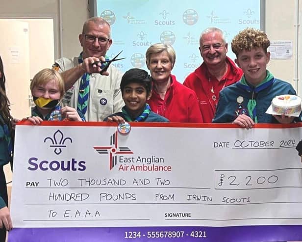 Scouts show off fundraising efforts, from no talking, hair cutting, cake making, swimming & games