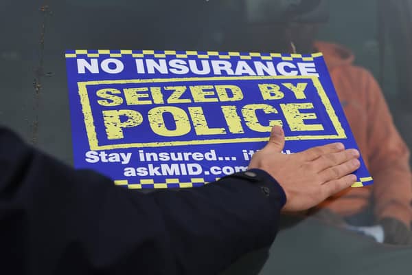 A sticker is placed on the windscreen of an uninsured car after it is seized by police