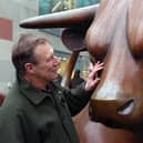 The late Laurence Broderick with his most famous sculpture - the iconic bull in Birmingham. He used to love going to the city incognito with his family to listen to visitors' comments