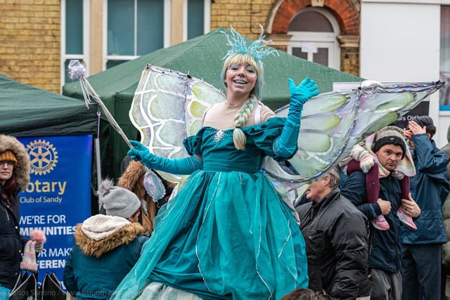 A stilt-walking Christmas fairy joined the fun