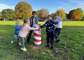 Children dance around the felled Maypole (Picture: Mike Wells)