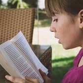 A girl reading a book outside. PIC: Petra from Pixabay