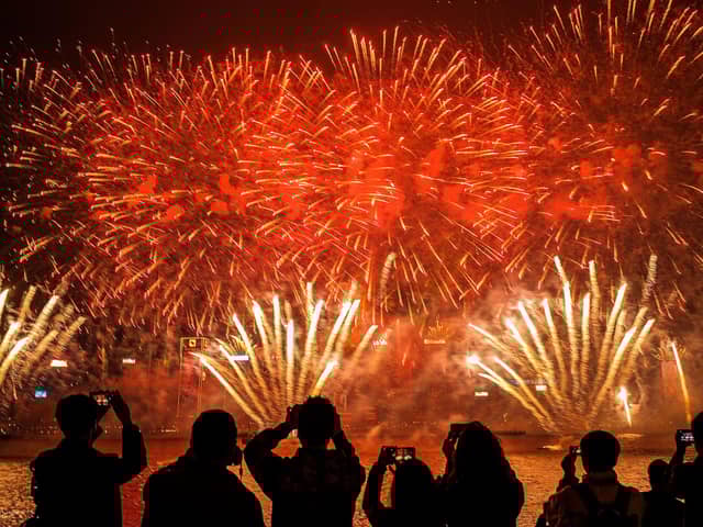 Fireworks illuminate the Hong Kong. Photo by Lam Yik Fei/Getty Images