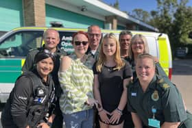 Lexi Ashwell (fourth from right) with her mum Michelle and some of the team from Bedfordshire Police and EEAST who helped save her life
