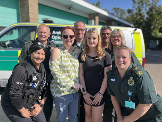 Lexi Ashwell (fourth from right) with her mum Michelle and some of the team from Bedfordshire Police and EEAST who helped save her life