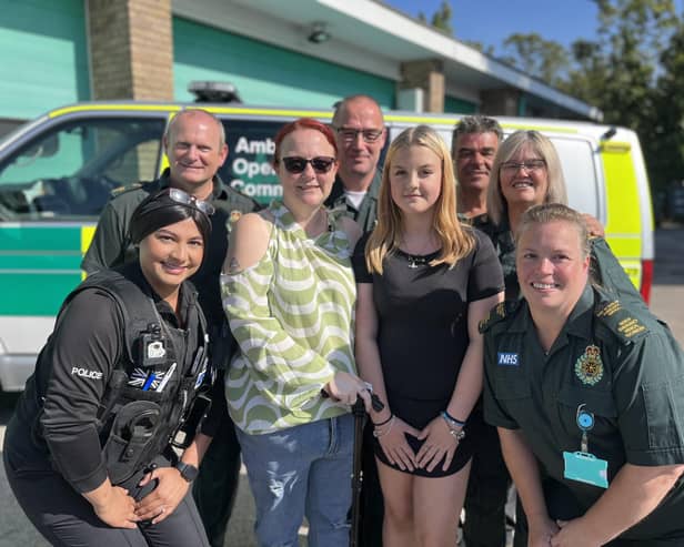 Lexi Ashwell (fourth from right) with her mum Michelle and some of the team from Bedfordshire Police and EEAST who helped save her life