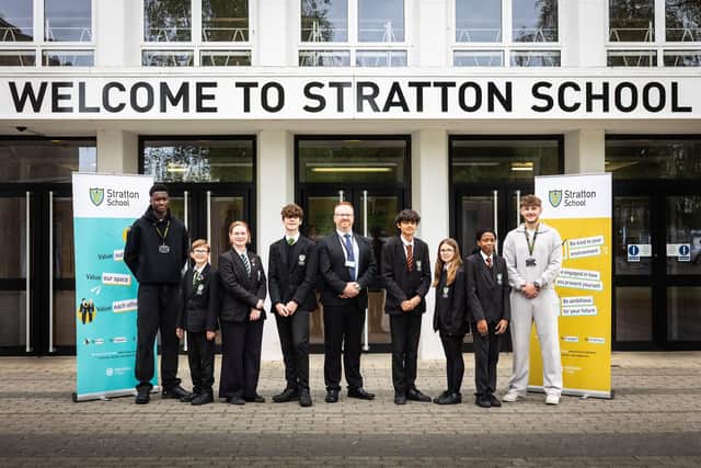Principal Sam Farmer with students from Stratton School celebrating a highly positive Ofsted report.