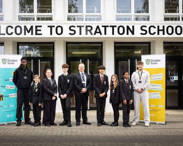 Principal Sam Farmer with students from Stratton School celebrating a highly positive Ofsted report.
