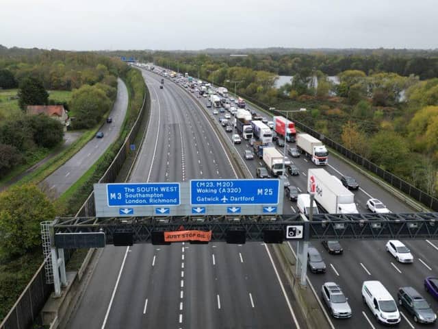 Police were forced to stop traffic when Just Stop Oil protesters climbed over a gantry on the M25
