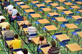 File photo of A-level students sitting an A-level math exam inside a sports hall.