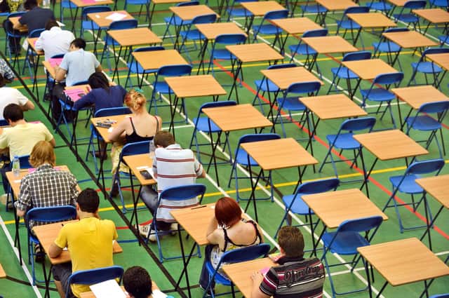 File photo of A-level students sitting an A-level math exam inside a sports hall.