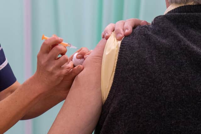 A patient receives an injection of a Covid-19 vaccine