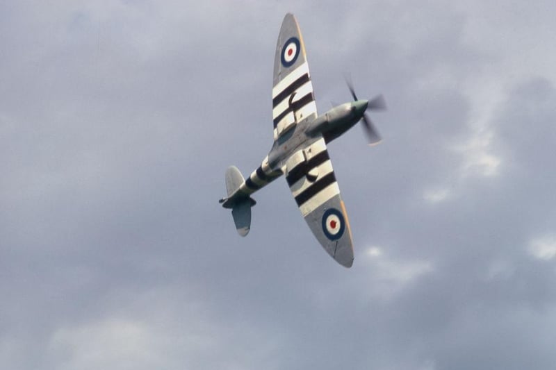 The underside of a World War II Supermarine Spitfire fighter plane on view as it flies during a display at Shuttleworth in August 1974.