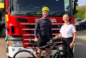 Tom Pyman pictured with ACFO Alison Kibblewhite outside Potton  Fire Station.