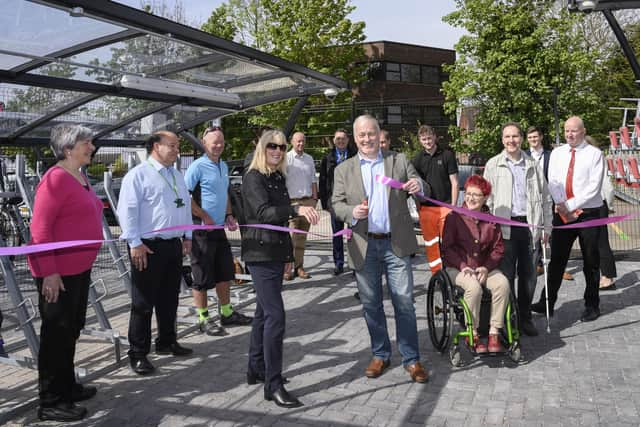 Biggleswade station manager Fiona Blackwell and MP Richard Fuller, supported by members of the community, declare the new cycle hub open. Photo: Peter Alvey.