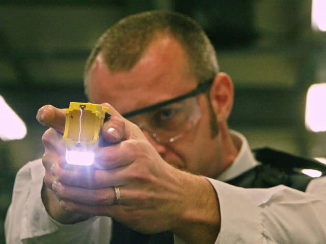 A police officer trains using a taser gun at the Metropolitan Police Specialist Training Centre. Picture: CARL DE SOUZA/AFP via Getty Images