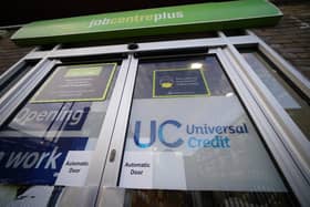 File photo of a Universal Credit sign on the door of a job centre plus
