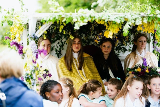 The May Queen and her entourage at the start of the procession. Left to right back row is one of the attendants, Eve, who presented the sceptre, Erin - the incoming May Queen, Amelia-Rose the May Queen who later handed over her crown to Erin, and Holly the attendant who presented the garland. Some of the girls who were flowers can be seen in the foreground.