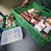 File photo of a crate of canned goods at a Trussell Trust foodbank