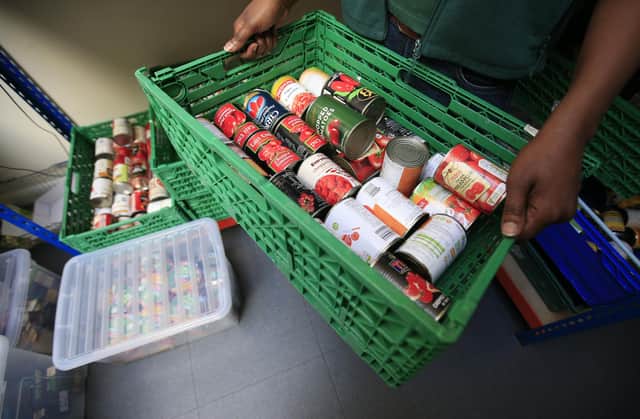 File photo of a crate of canned goods at a Trussell Trust foodbank