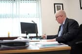 John Tizard, Bedfordshire Police and Crime Commissioner working in his office