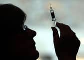 A nurse preparing to give a patient a vaccine Picture: David Cheskin/PA