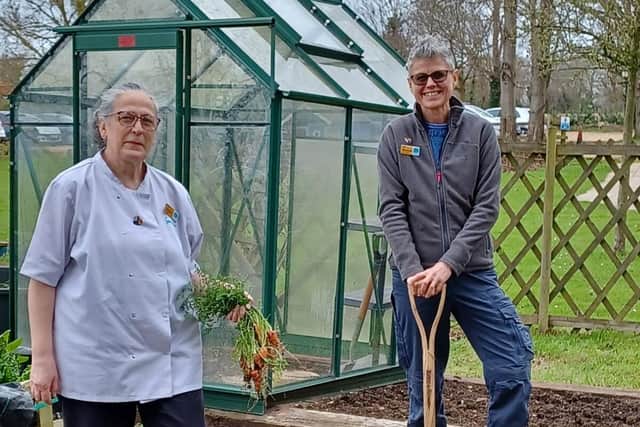 Hospice Chef Sandra Galton and gardening volunteer Debbiw Brown in the kitchen garden