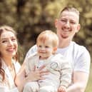 Adam Dilley with partner Tash and their son, Alfie