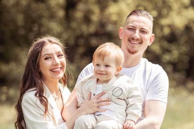 Adam Dilley with partner Tash and their son, Alfie