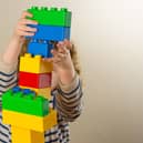 Child playing with building blocks. Picture: Dominic Lipinski/PA Wire