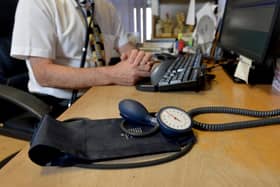 Image of a GP at their desk. Picture: Anthony Devlin