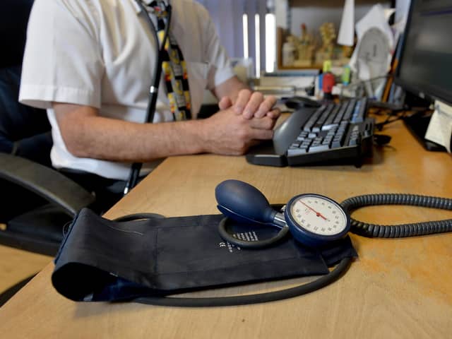 Image of a GP at their desk. Picture: Anthony Devlin