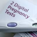 A pregnancy test kit indicating pregnancy.  Gareth Fuller/PA Wire