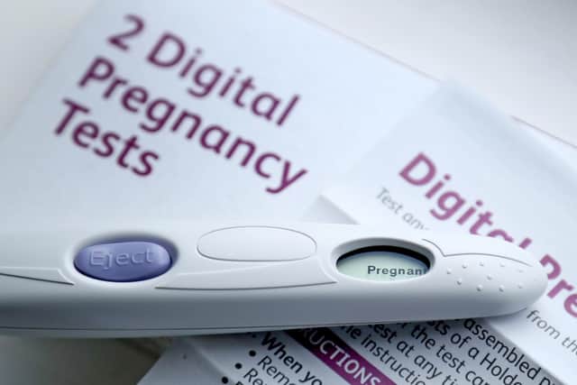 A pregnancy test kit indicating pregnancy. Gareth Fuller/PA Wire
