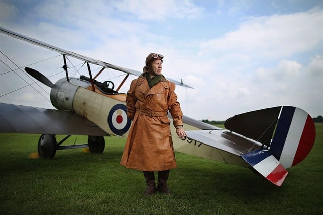 Shuttleworth Collection Pilot Rob Millinship, poses next to a Sopwith Pup during a photocall at 'The Shuttlesworth Collection' on July 21, 2014.