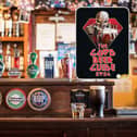 A bar in a pub and, inset, the front cover of the CAMRA Good Beer Guide 2024