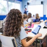 File photo of children in a classroom. Photo: Adobe