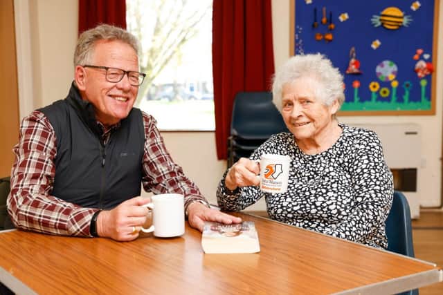 Attendees at St Andrew's Church enjoy a friendly chat over a cup of tea at their warm space