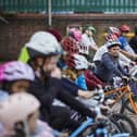 Children learn cycle skills on the playground during Level 1