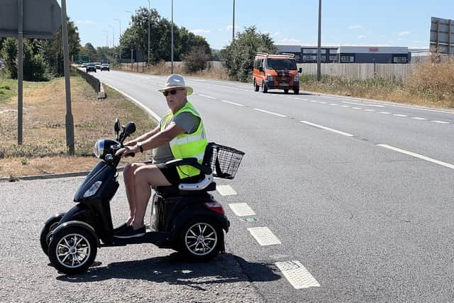 Pete Cross at the Tingey's Corner crossing as he travels to do a shopping trip in Sainsbury's. Image: Mike Wells.