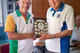 Terry Butt handing the John Gabbitas Scroll to Ted Houldey