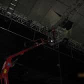 Russell Bowry was working on the roof of a temporary rehearsal stage when he fell through the structure.