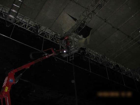 Russell Bowry was working on the roof of a temporary rehearsal stage when he fell through the structure.