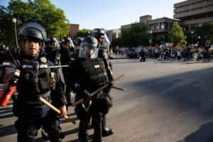 Police officers in riot gear stand across from protesters in Louisville, Kentucky (Photo: Brett Carlsen/Getty Images)