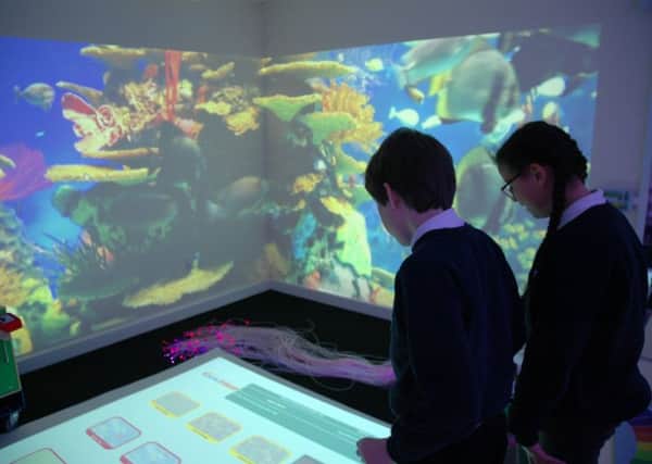 Pupils using Ivel Valleys interactive sensory room equipment