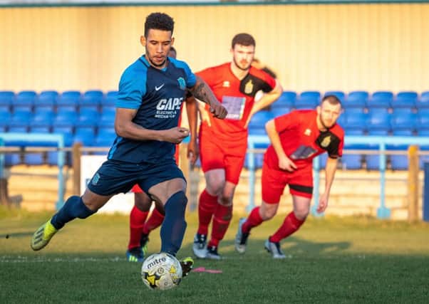 Lorrell Smith levels for Arlesey. Picture: Guy Wills