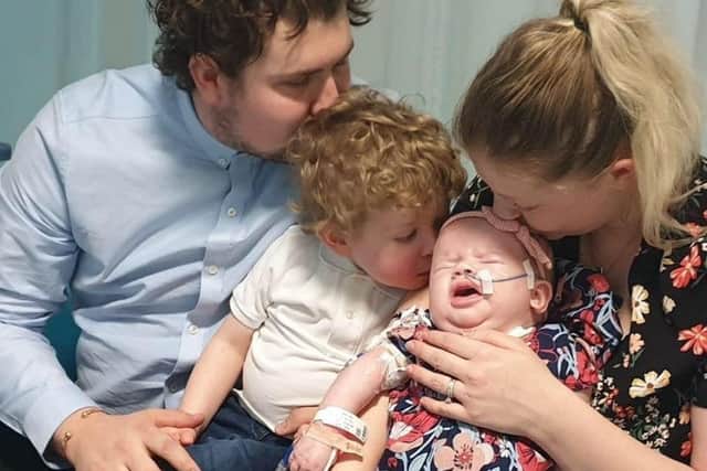 Family photo: Josh, Harrison, Hallie and Rebecca. Joshs favourite memory is singing You Got a Friend in Me to Hallie, while Rebeccas is having cuddles when they were allowed to take her out from her cot. The pair had around 10 cuddles during Hallie's lifetime.