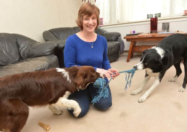 Tracey Fountain from the carnival committee with her two dogs Treacle (brown) and Merlin (black)