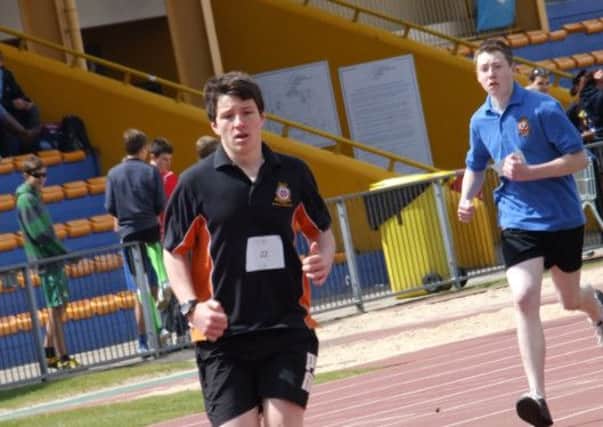 Cadet Mansion in the lead of the 800 metres on his way to first place at the Bedfordshire and Cambridgeshire wing athletics competition.